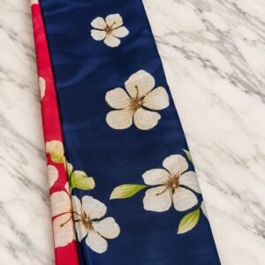 Navy blue cotton saree with cream floral print and red border